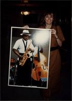 Susan Krause shows off an Ahmad Alaadeen poster in Skopje