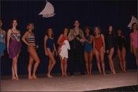Ten women and one male Stevens models stand in a line during the Boat Show Fashion Show