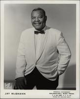Publicity photo of Jay McShann in a white jacket