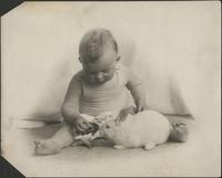 Toddler with white rabbit
