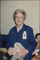 Volunteer Joan Elliott with stuffed rabbit