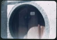 Hiller 08-021: Circular entrance encasing a wooden door