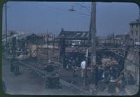 Hiller 11-013: Street lined with wooden structures, Thieves Market, Kiangwan