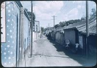 Hiller 08-018: Alleyway between a row of buildings and a wall, Peiping