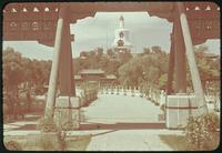 Hiller 08-063: View of a white, pointed building, framed by two columns, Peiping