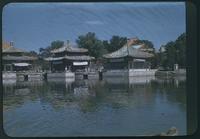 Hiller 08-071: Small structures sitting on platforms on a body of water, Peiping