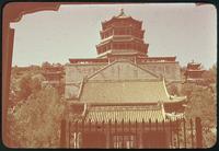 Hiller 08-136: Multi-story building standing on a hill behind an iron fence, Peiping