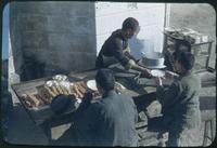 Hiller 08-010: A man cooking and serving other men food, Teintsin, China