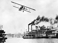 Beachy-Curtis Biplane Over the Mississippi River