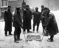 Workers In Snowy Street