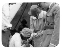 Red Cross Workers Tending to Mother and Child