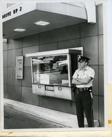 Patrolman Standing Outiside At The Gateway National Bank Drive-Thru