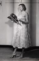 Mrs. Chester H. Volkman Leafing Through a Fashion Magazine