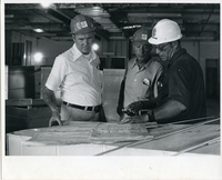 Workers Looking at Plans