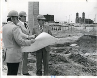 Men Surveying Construction Center Site