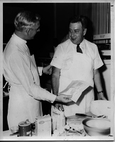 Jack Buck and Bob Burnes Baking a Cake