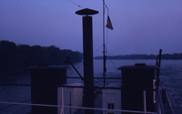 Flag on Top of Towboat at Dusk