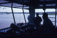 Workers in the Pilot House With River Behind 