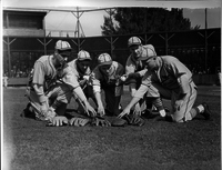 Five Cardinals Players Reaching for Gloves