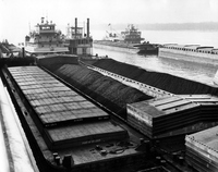 Unidentified Towboats and Port of St. Louis barge.